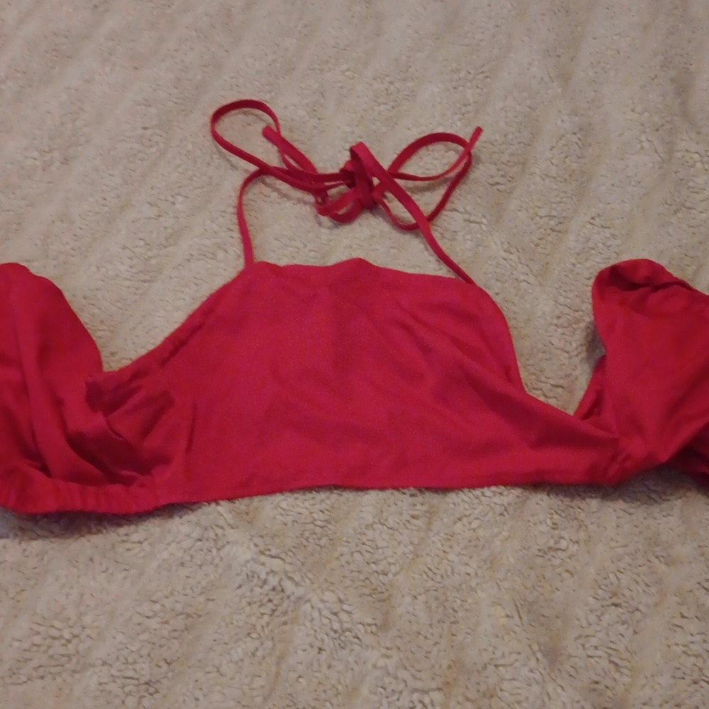 Crop top with puffy sleeves, tie behind neck and tie behind back. Backless.